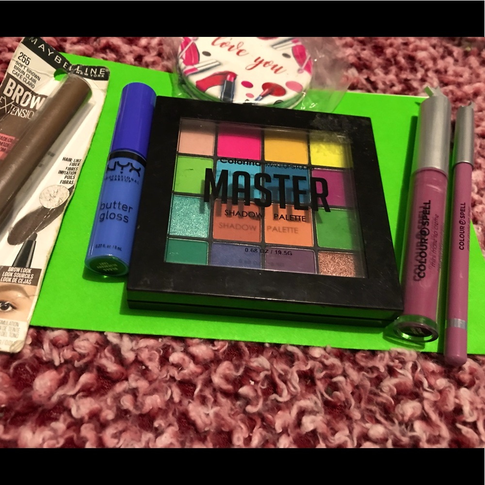 Eyeshadow, lip gloss, eyebrow ext. and a mirror
